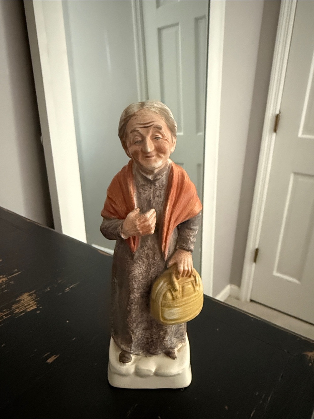 Hand-Painted Elderly Woman Figurine in Brown and Orange